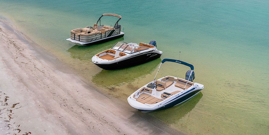 Three Hurricane Boats parked on the water